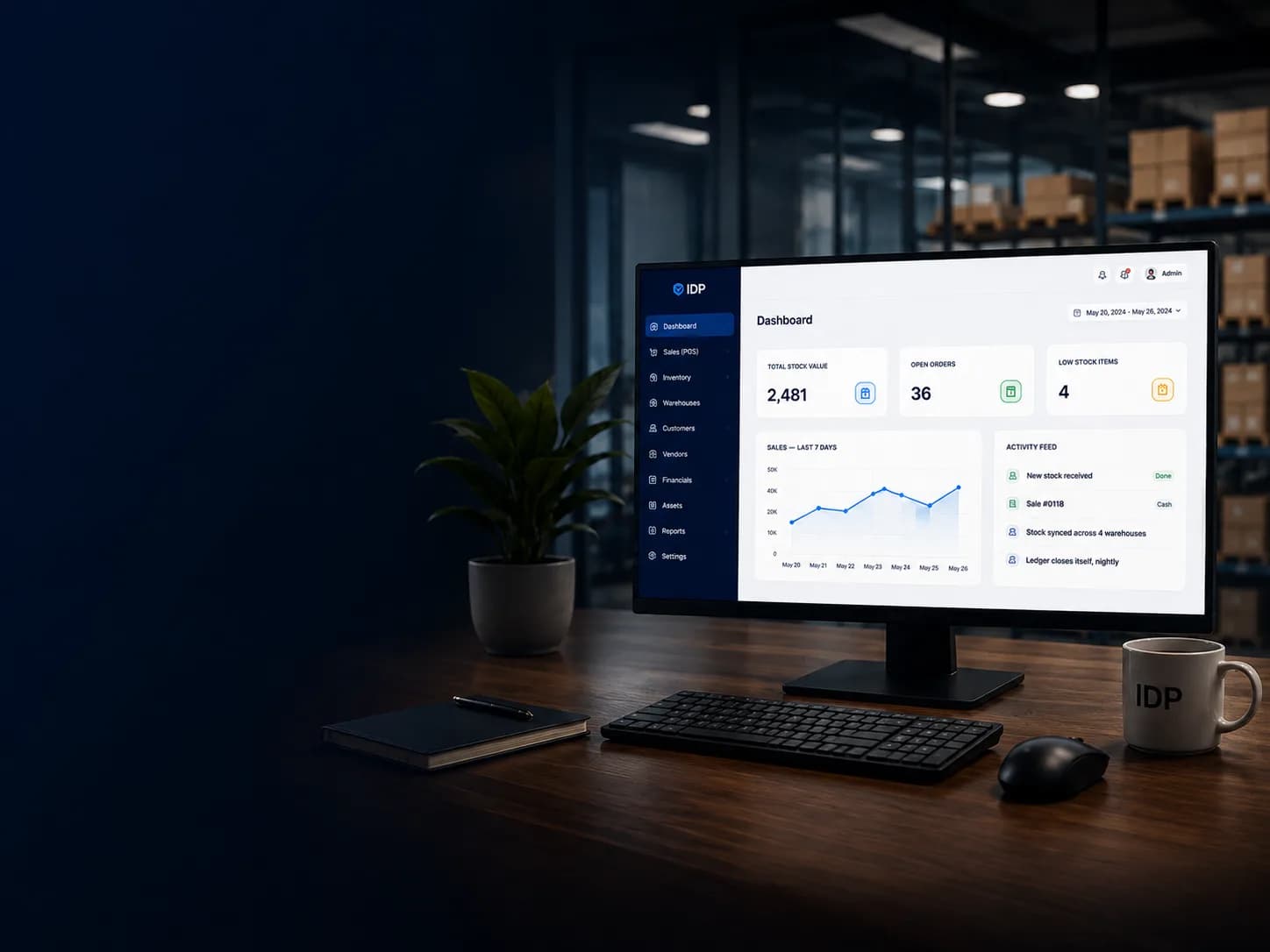 A desktop monitor on an office desk showing the IDP dashboard